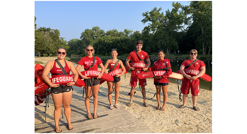 six lifeguards holding their rescue tubes at the Green River